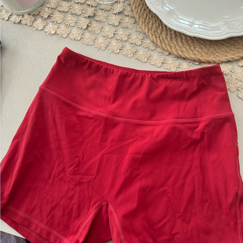 Alphalete shorts probably like a 5 inch inseam fits size 6 red
